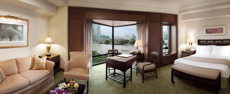 Deluxe room at a Bangkok hotel. A waterfront view from the window.