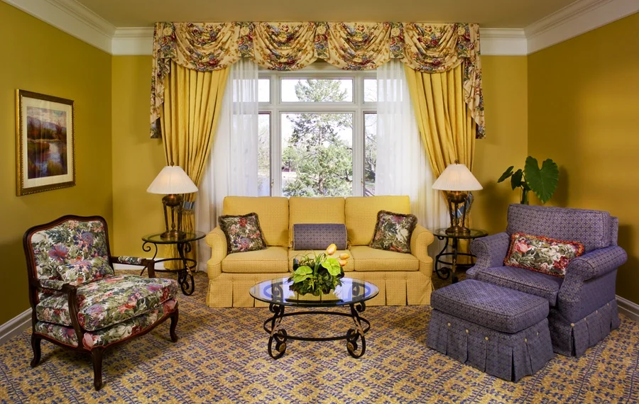 Purple and yellow-themed room with coordinating custom drapery.