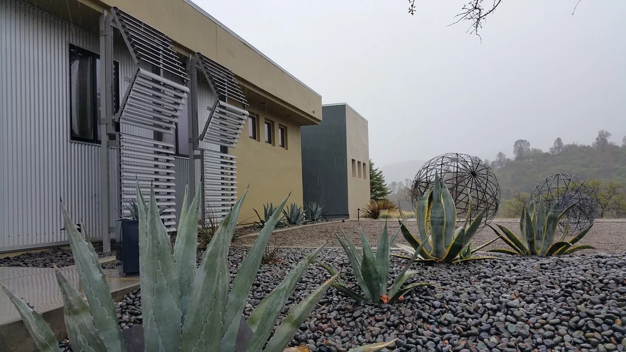 Custom metal shutters installed on the exterior of an art gallery.