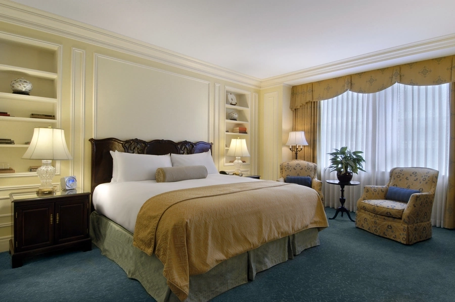 Bedroom of a suite at the Fairmont Hotel. Custom drapes designed by Skyco.