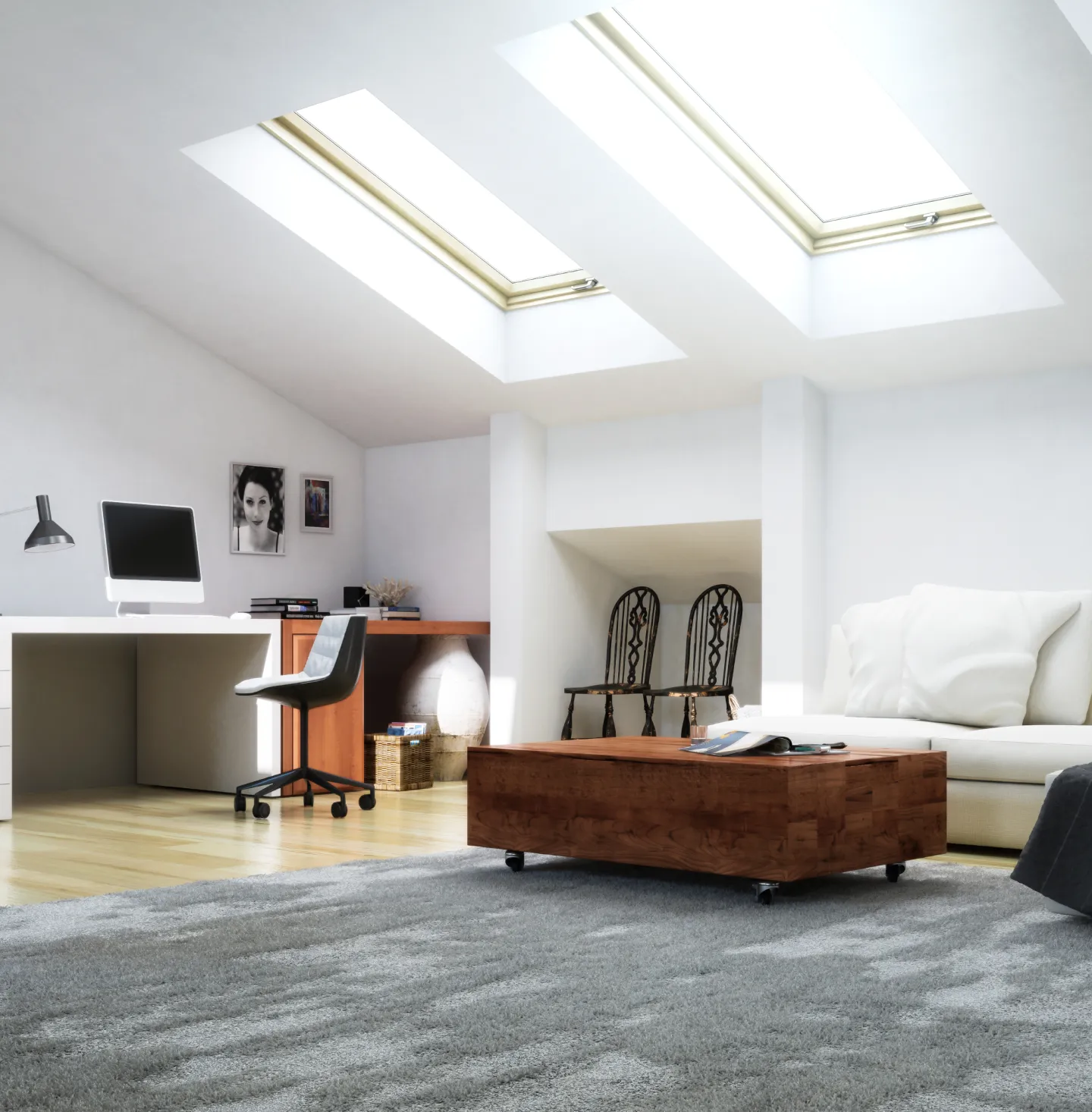 Expansive, modern office with two skylights shining down on a couch.