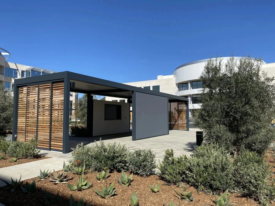 Outdoor lounge next to a San Diego office space. Wooden shutters by Skyco.