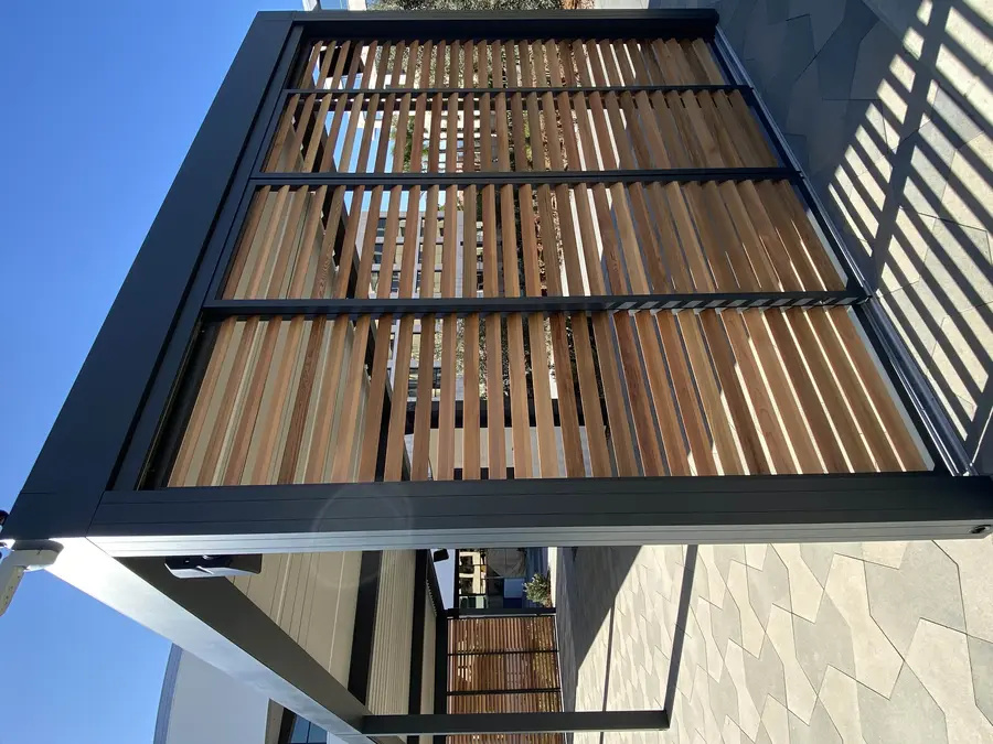 Outdoor lounge in San Diego. Skyco provided custom wooden shutters.